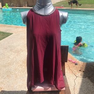 Burgundy top with neckline embellishment